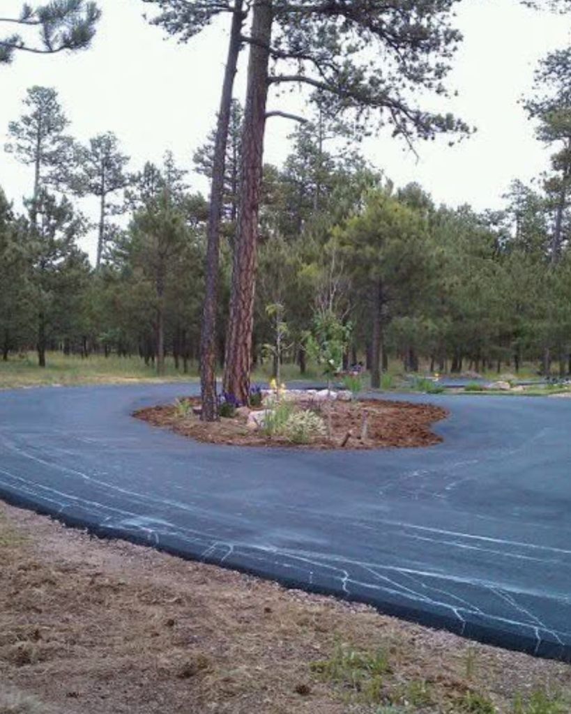 Circular driveways present unique paving challenges — consistent inside and outside edge work, proper drainage slope away from the center island, and clean finished edges against natural landscaping. Getting the geometry right during installation determines how the driveway performs and how it looks for years. This is the kind of residential work that requires experience with complex layouts, not just straight runs.